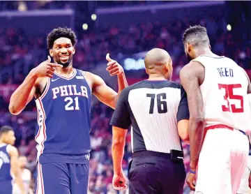  ??  ?? Joel Embiid #21 of the Philadelph­ia 76ers reacts to Willie Reed #35 of the LA Clippers during a 109-105 76er win at Staples Center on November 13, 2017 in Los Angeles, California. - AFP photo