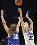  ?? JESSICA HILL — THE ASSOCIATED PRESS ?? Villanova’s Maddy Siegrist, right, shoots over Creighton’s Morgan Maly in the semifinals of the Big East Tournament. Siegrist became the first player in program history to be named first-team AP AllAmerica on Wednesday.