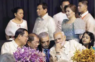  ?? — Reuters ?? Prime Minister Narendra Modi speaks with his Cambodian counterpar­t Hun Sen as Philippine President Rodrigo Duterte arrives for the Asean Summit gala dinner in Manila on Sunday.
