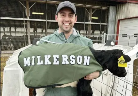 ?? COURTESY OF JARED KURTZ ?? Jared Kurtz with “Milkerson,” one of five new cows named for Eagles players at Kurtland Farms near Elverson