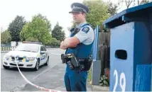  ?? Photo: FAIRFAX NZ ?? Constable Jesh Scheib stands guard outside the Motueka property where amanwas shot.