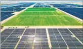  ?? Robert Gauthier Los Angeles Times ?? SOLAR FARMS surround an alfalfa field in the Imperial Valley, called the nation’s “salad bowl.”