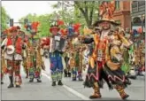  ??  ?? The Mummers Ferko Band had the crowd tapping their feet and even strutting on the sidewalk at the Kennett Square Memorial Day parade Monday.