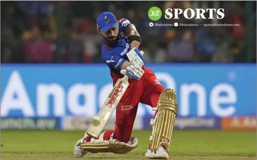  ?? AP ?? Royal Challenger­s Bengaluru’s Virat Kohli hits a six during the match against Punjab Kings. —