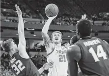  ?? Chris Covatta / Getty Images ?? Texas forward Dylan Osetkowski (21) ranks fourth in the Big 12 in offensive rebounds and total rebounds.