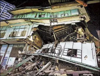  ??  ?? Photo shows a decades-old residentia­l building that collapsed in Binondo, Manila apparently due to structural weakness last Wednesday night. The five families living in the building, which used to be the Binondo Maternity Hospital, were evacuated before the collapse.