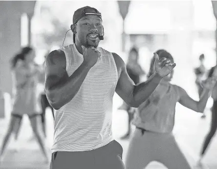  ?? JUNFU HAN/ USA TODAY NETWORK ?? Armond Rashad Harris, the owner of Jabs Gym in Detroit, leads an outdoor workout in August amid the Michigan governor’s order that closed gyms. Many CEOs and economists remain hopeful that next year’s economic outlook will be healthy now that a vaccine has rolled out.