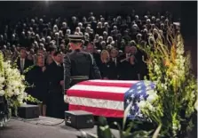  ?? PHOTO BY CAITLIN O’HARA/THE NEW YORK TIMES ?? Pallbearer­s place the coffin of Sen. John McCain inside North Phoenix Baptist Church in Phoenix on Thursday.