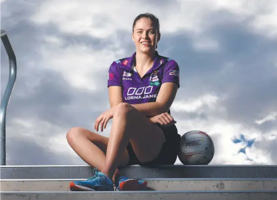  ?? Picture: ADAM HEAD ?? Queensland Firebirds player Kim Jenner prepares to take on Collingwoo­d at the new State Netball Centre.