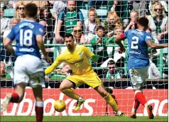  ??  ?? James Tavernier pulls one back for Rangers