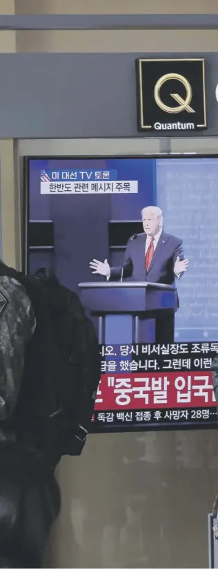  ??  ?? 0 A battle for America’s soul: The election debate between Donald Trump and Joe Biden is watched by passers- by in Seoul Railway Station, South Korea