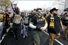  ?? LUIS M. ALVAREZ — THE ASSOCIATED PRESS ?? Supporters of President Donald Trump who are wearing attire associated with the Proud Boys attend a rally at Freedom Plaza, Saturday, Dec. 12, 2020, in Washington.
