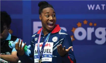  ?? Photograph: Quinn Rooney/Getty Images ?? Simone Manuel of the United States poses during the medal ceremony after winning the women’s 100m freestyle final at Nambu Internatio­nal Aquatics Centre in Gwangju, South Korea.