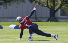  ?? AP PHotos ?? STUD: Patriots quarterbac­k Cam Newton warms up during practice on Sunday in Foxboro. The team’s new signal caller is pulling away from the pack in the competitio­n for the starting job.