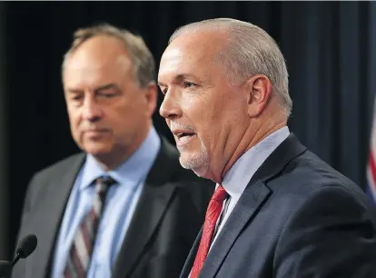  ?? CHAD HIPOLITO/THE CANADIAN PRESS ?? Premier John Horgan, right, and Green party Leader Andrew Weaver differ on LNG.