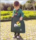  ??  ?? Scores of photos were shared online this month as adults and youngsters proudly posed with their new shopping bags