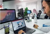  ?? AFP ?? A Saudi employee using a laptop to prepare a slideshow at his office in the capital Riyadh. —