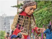  ?? Taku Kumabe/smaku.com ?? Little Amal, A 12-foot-tall puppet of a Syrian girl, can be spotted around San Antonio this weekend.