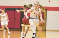  ?? ?? Feil spins past Marist’s Elise Ward during a game on Dec. 8.