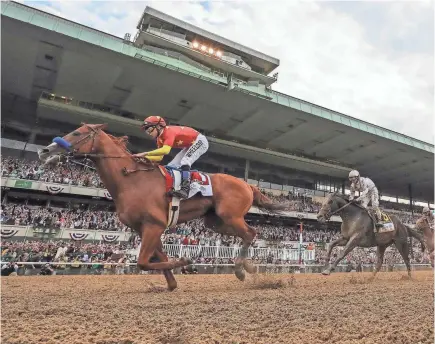  ?? MICHAEL CLEVENGER AND CHRIS GRANGER/THE (LOUISVILLE) COURIER-JOURNAL ?? The connection­s of Triple Crown winner Justify said Sunday that plans include having him race again during the 2018 season.
