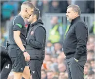  ?? ?? Referee David Dickinson walks past Ange Postecoglo­u on his way to the VAR monitor