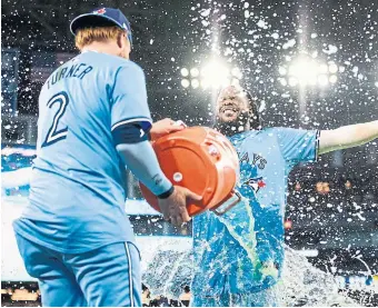  ?? NICK LACHANCE TORONTO STAR ?? Justin Turner douses Blue Jays teammate Vladimir Guerrero Jr. with Gatorade after Saturday’s win.