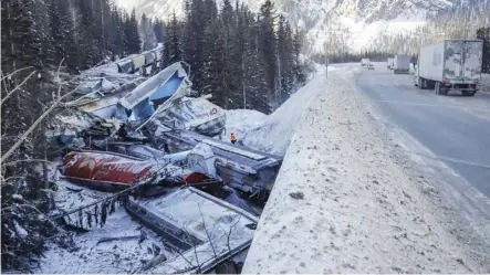  ?? Jeff McIntosh/the cAnADIAn PRess ?? Transport Minister Marc Garneau said late Friday he was issuing an order mandating the use of handbrakes on all trains stopped on mountain slopes until the cause of this week’s fatal derailment east of Field, B.C. is determined. The order takes effect immediatel­y, Garneau said.