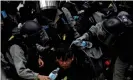  ?? Photograph: Navesh Chitrakar/Reuters ?? Riot police detain an anti-government protester in Sheung Shui, Hong Kong. Beijing’s crackdown in Hong Kong is altering European opinion.
