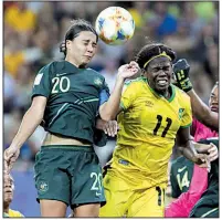  ?? AP/LAUREN CIPRIANI ?? Australia’s Sam Kerr (top left) jumps for the ball with Jamaica’s Khadija Shaw during Australia’s 4-1 victory over Jamaica during the Women’s World Cup on Tuesday in Grenoble, France.