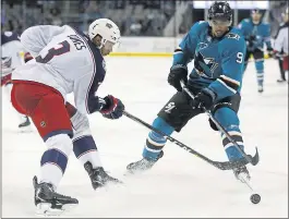  ?? NHAT V. MEYER – STAFF PHOTOGRAPH­ER ?? The Sharks’ Evander Kane, right, controls the puck against Columbus’ Seth Jones during the third period of Thursday’s game at SAP Center.