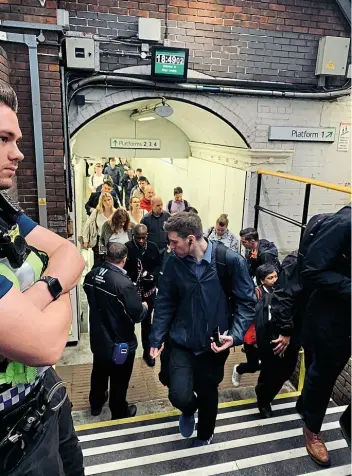  ?? ALL OTHER PICTURES BY WEST MIDLANDS TRAINS ?? Right: Rush-hour commuters facing ticket checks at Kings Langley during the operation on August 14, 2019.