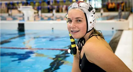  ?? PHOTO: ROSA WOODS/STUFF ?? Belle Burdon is a 15-year-old partially sighted underwater hockey player. Underwater Hockey NZ changed all their pucks to fluoro in order to help her see them.