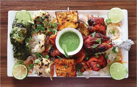  ??  ?? If you’ve got a heartier appetite, the Big Singh mix platter will satisfy all your cravings with a platter filled with tandoor-cooked chicken and paneer.