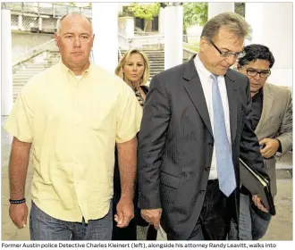  ?? JAYJ ANNER / AMERICAN-STATESMAN ?? Former Austin police Detective Charles Kleinert (left), alongside his attorney Randy Leavitt, walks into the Blackwell-Thurman Criminal Justice Center to be booked Monday after a grand jury indicted himin the shooting death July 26 of Larry Eugene...