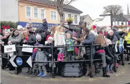  ??  ?? Festive fun Folk in Strathaven wait for Sunday’s parade