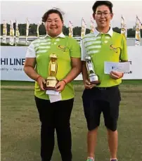  ??  ?? Good job: Mirabel Ting holding her trophy with the help of her elder brother Malcolm, who finished a creditable 10th in the boys’ 15-18 age group.