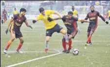  ?? AIFF ?? Real Kashmir (in yellow) and Gokulam Kerala FC players slugged it out in snow and heavy rain on Wednesday.