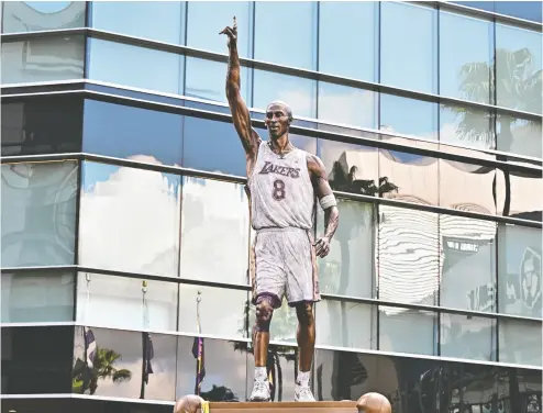  ?? FREDERIC J. BROWN / AFP VIA GETTY IMAGES ?? The Kobe Bryant statue, unveiled to the public outside the Crypto.com Arena last month, features a number of spelling
errors in the box score etched into the statue’s marble base. The Lakers say they are working to get them corrected.