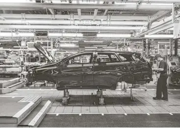  ?? Tom Jamieson / New York Times file ?? A car moves along the assembly line at Toyota Manufactur­ing UK in Burnaston, United Kingdom. Japan’s trade deal with the European Union is expected to bolster sales in Europe for Japanese automakers.