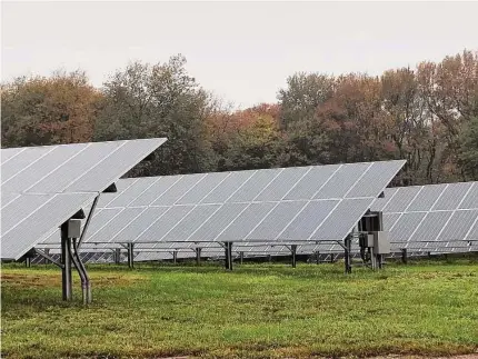  ?? Leslie Hutchison/Hearst Connecticu­t Media ?? A solar array at White Flower Farms in Litchfield County. The American Farmland Trust surveyed more than 175 Connecticu­t farmers, with a majority stating they would consider “dual-use” solar installati­ons that allowed for the continuing use of farmland below or around panel arrays.