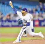  ??  ?? Blue Jays starter Marcus Stroman unloads against the Rangers during the first inning in Toronto.