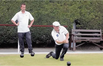  ??  ?? Mark Whiteley of Rhos Park in recent action against Craig Richardson of Min-y-Don