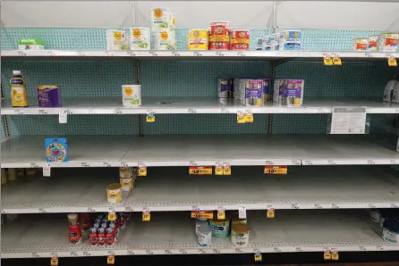  ?? The Associated Press ?? Baby formula is displayed on the shelves of a grocery store in Carmel, Ind., Tuesday. Parents across the U.S. are scrambling to find baby formula because supply disruption­s and a massive safety recall.