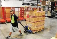  ??  ?? Amazon is looking to hire hundreds at its warehouse in Robbinsvil­le on Wednesday.