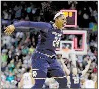  ?? AP/TONY DEJAK ?? Notre Dame’s Arike Ogunbowale celebrates as time expires in the Fighting Irish’s upset victory over Connecticu­t on Friday night in the women’s national semifinals at Columbus, Ohio.