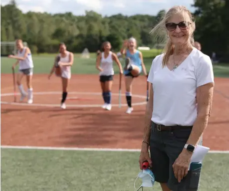  ?? NAncy lAnE pHotos / HErAld stAFF ?? ‘KEPT ME IN THE BALLGAME’: Longtime Medway field hockey coach Mary Ellen Hasenfuss is entering her 50th season on the sidelines this fall. Below, Hasenfuss talks to her team on the practice field last week.