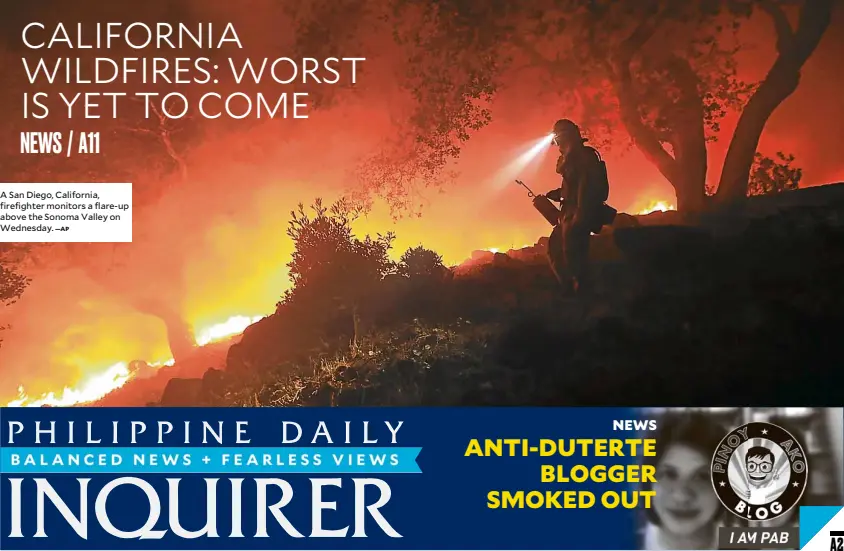  ?? AP ?? A San Diego, California, firefighte­r monitors a flare-up above the Sonoma Valley on Wednesday.—