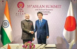  ?? PTI ?? Prime Minister Narendra Modi shakes hands with his Japanese counterpar­t Shinzo Abe during a bilateral meeting on the sidelines of 16th INDIA-ASEAN Summit, in Bangkok, Thailand, Monday