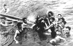  ?? — Reuters photo ?? McCain being pulled out of a Hanoi lake by a mix of North Vietnamese Army (NVA) and Vietnamese citizens in this file photo.