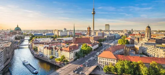  ??  ?? An aerial view of Berlin’s skyline, with the famous TV tower and Spree river — the city imposed a rent freeze some months ago